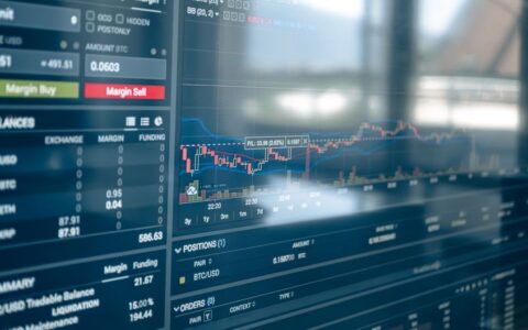 Close-up of a digital screen displaying stock trading graphs and cryptocurrency values. Ideal for finance and technology themes.